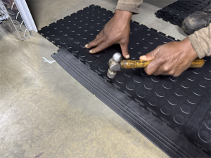 Dura Tile PVC interlocking floor tile being installed