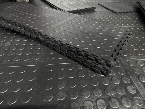 Stacked Dura Tile PVC interlocking floor tiles ready for installation