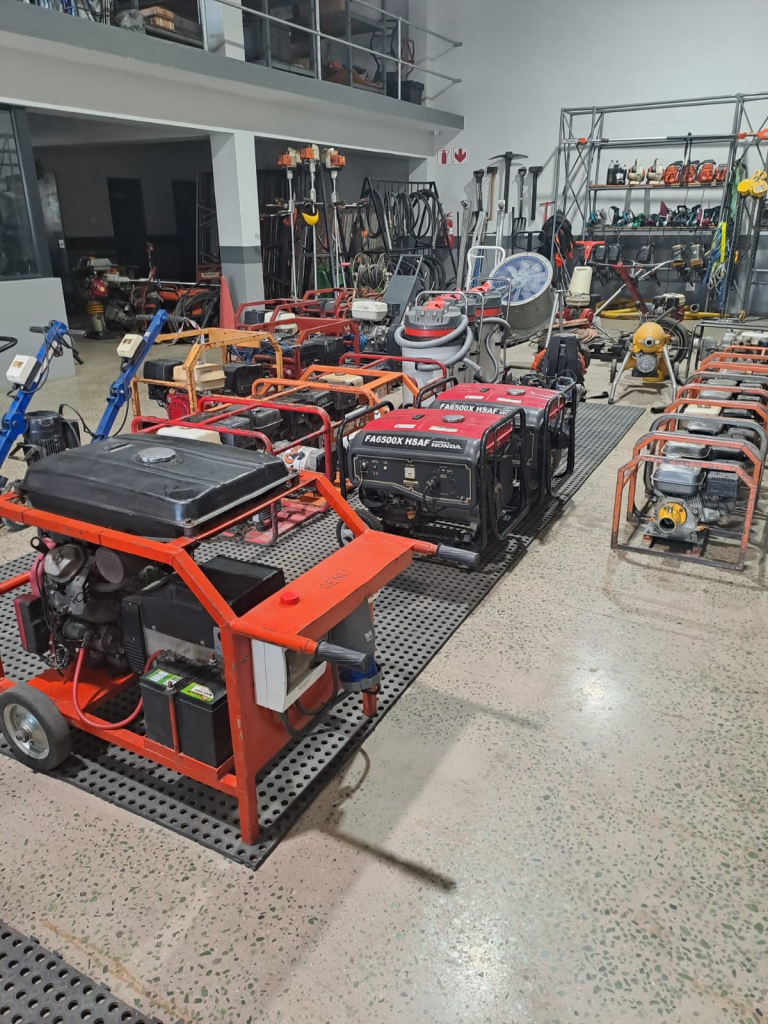 Dura Drain tiles installed beneath machinery in a machine hire warehouse