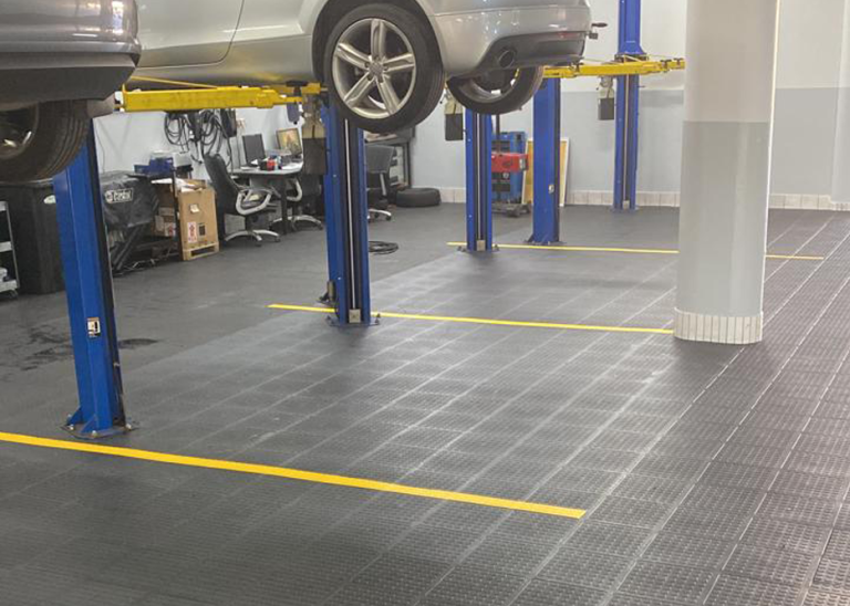 Dura Tiles installed across a commercial vehicle garage floor