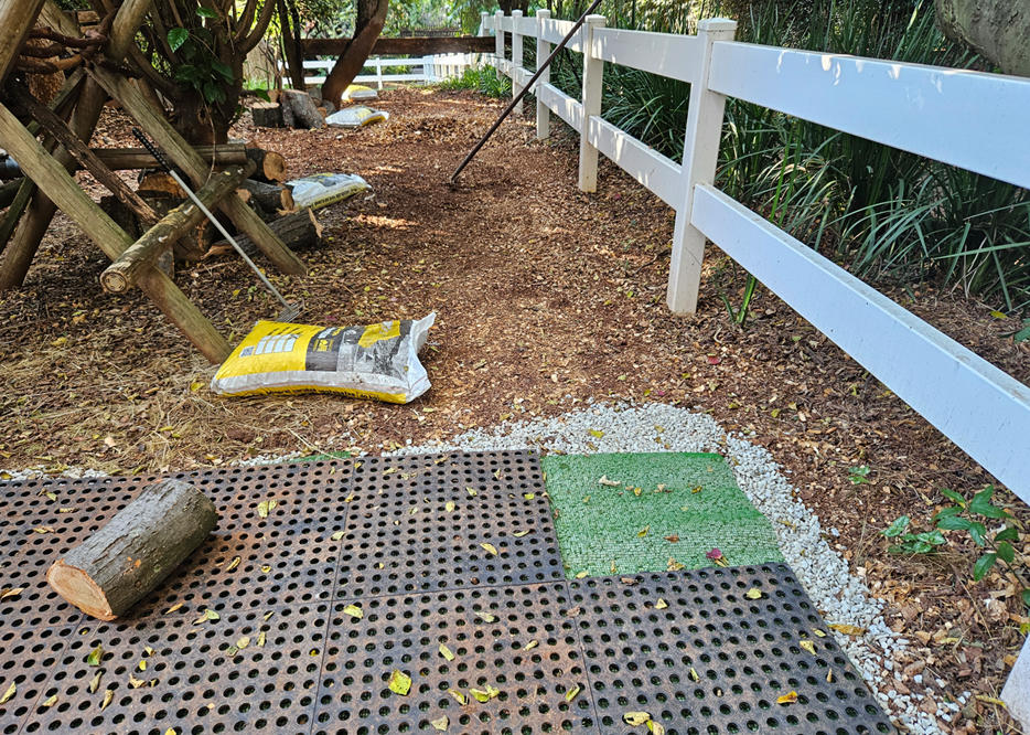 Dura Drain tiles being installed in a muddy pony enclosure