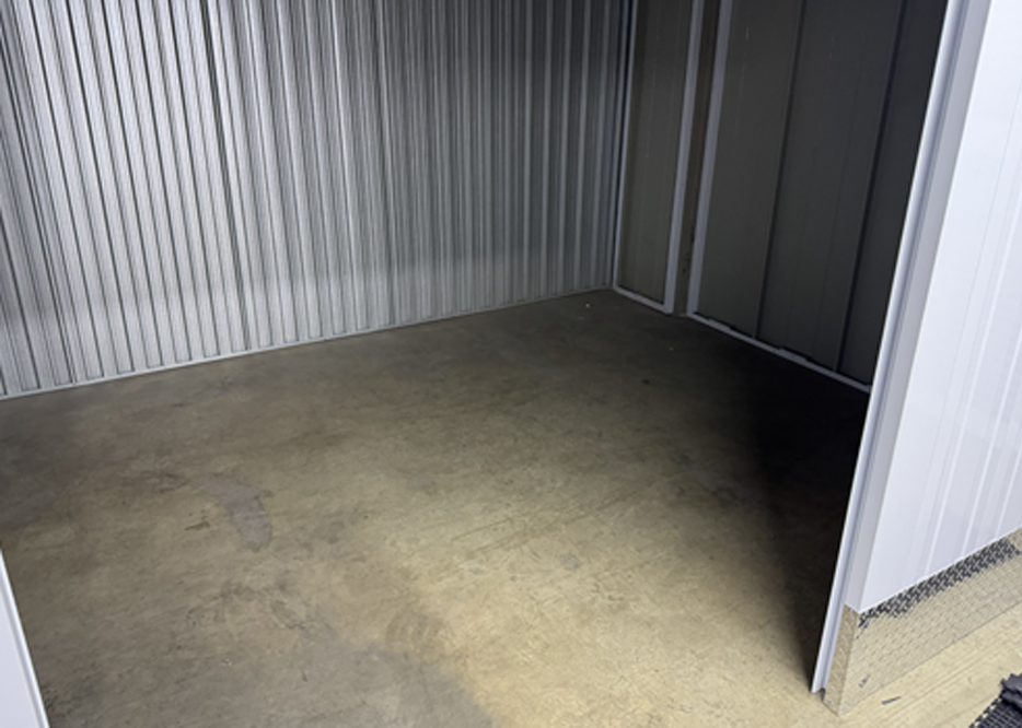 Self storage unit with existing concrete floor before Dura Tile installation