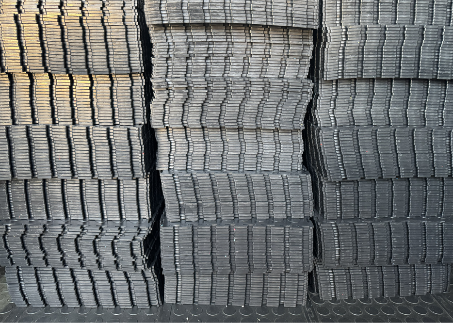 Stacks of PVC interlocking tiles at the Durable Floors manufacturing facility